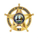Gold sheriffs badgestar insignia with a blue circular seal in the center and Office of the Sheriff text indicating a New Jersey county sheriff emblem