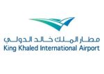 Logo for King Khaled International Airport with turquoise stylized wings and bilingual Arabic English text